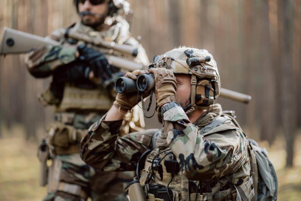 Soldiers spotting FPV drone to engage with kinetic modern drone defense system